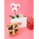 Orquidea com Coração Trufado Caramelo salgado com castanha caramelizada e chocolate meio amargo